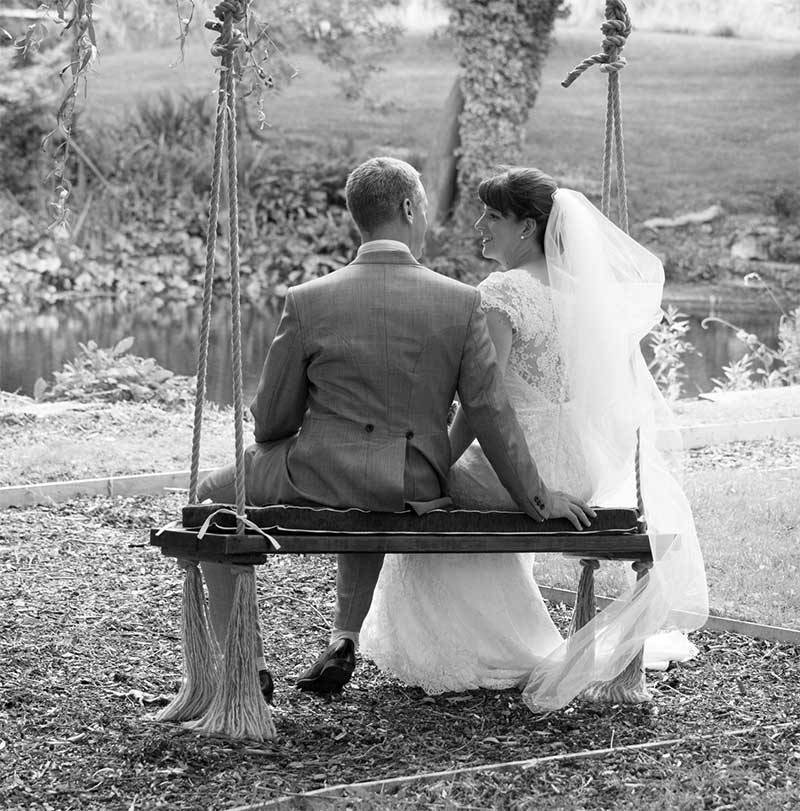 couple on a swing at their wedding