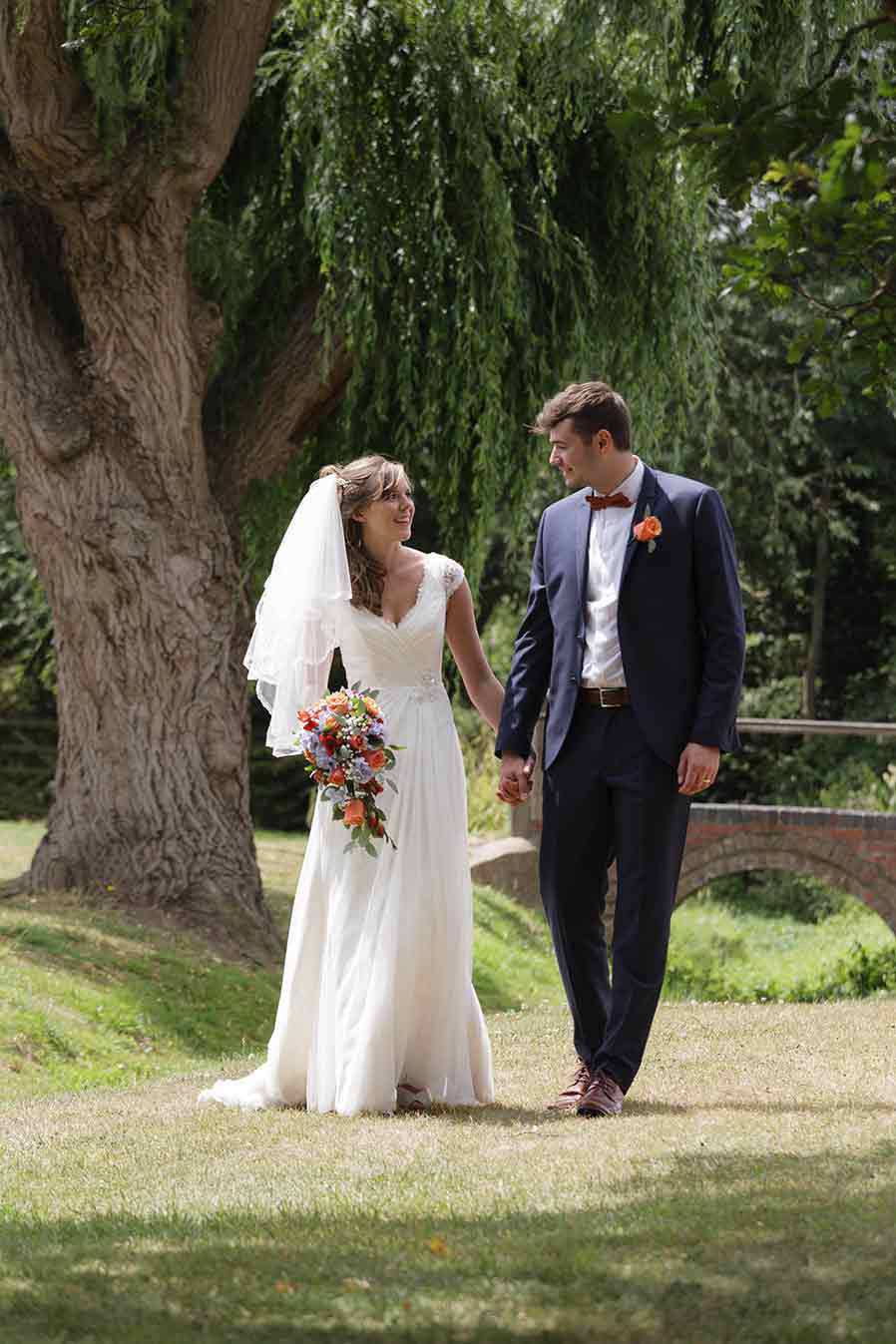 Worcestershire couple walking at their wedding